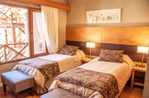 Ένα ή περισσότερα κρεβάτια σε δωμάτιο στο Los Robles Apart & Spa +16 φωτογραφίες