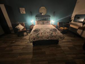 a bedroom with a bed and a table and a piano at Pine Studio in Blackpool