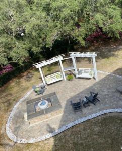 an overhead view of a patio with a table and chairs at NEWMANS BEACHVIEW home in Jekyll Island