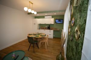 a kitchen and dining room with a table and chairs at Fresh&Relax in Chamalières