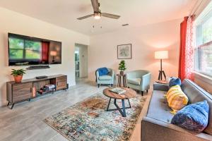 a living room with a couch and a tv at Bright, Pet-Friendly Retreat in Avon Park! in Avon Park