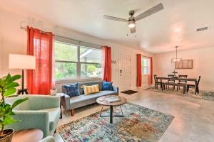 a living room with a couch and a table at Bright, Pet-Friendly Retreat in Avon Park! in Avon Park