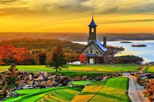 a painting of a church on a golf course at Remodeled NO STEPS Citrus Lane Luxury Amazing View in Branson