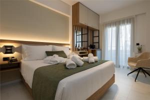 Postel nebo postele na pokoji v ubytování Ruby Luxury Suites