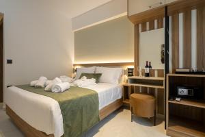 Postel nebo postele na pokoji v ubytování Ruby Luxury Suites
