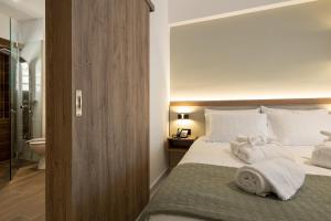 Postel nebo postele na pokoji v ubytování Ruby Luxury Suites