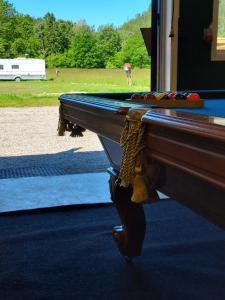 a pool table in front of a field at Älgbergets Bed & Breakfast in Ucklum