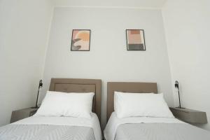 A bed or beds in a room at Santa Chiara Luxury House