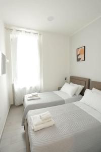 A bed or beds in a room at Santa Chiara Luxury House