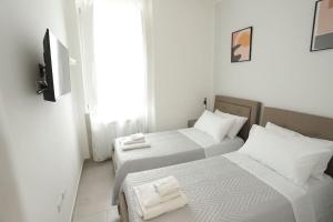 A bed or beds in a room at Santa Chiara Luxury House