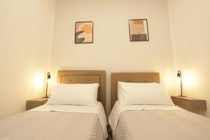 A bed or beds in a room at Santa Chiara Luxury House