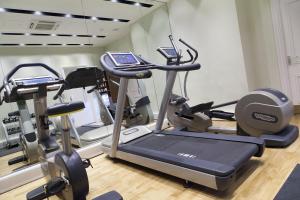 a gym with two tread machines and a treadmill at Thistle London Piccadilly in London
