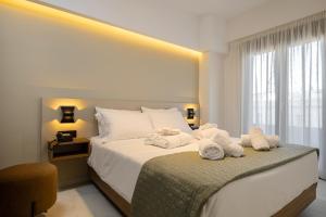 Postel nebo postele na pokoji v ubytování Ruby Luxury Suites