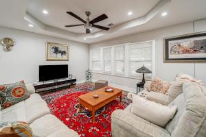 a living room with two couches and a television at East Point Elegance in Atlanta