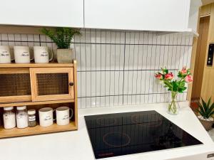 a kitchen with a counter with a stove top oven at ARA125 in Seoul +59 photos