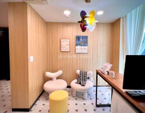 a waiting room with two chairs and a desk at ARA125 in Seoul