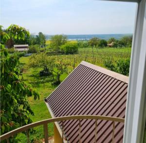 a balcony with a view of a field of grapes at Tóthék Apartman in Szigetvár
