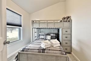 a bedroom with a bunk bed and a window at Rutland's Hidden Gem- 2 BR 1BA Renovated Home Close to Everything home in Rutland