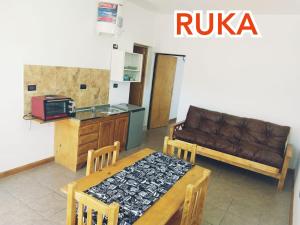 a living room with a couch and a table at RUKA Apart in Chilecito