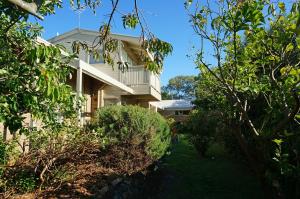 a house with bushes in front of it at Rip Tide in Point Lonsdale