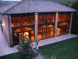 an aerial view of a large house with a porch at Agriturismo La Lupa in Madonna della Provvidenza