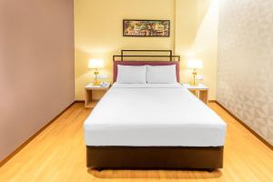 Postel nebo postele na pokoji v ubytování MPalace Hotel KL