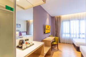 Postel nebo postele na pokoji v ubytování MPalace Hotel KL