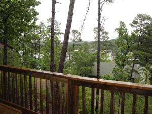a view from the deck of the house at C7, Three bedroom, three bath log-sided, luxury Harbor North cottage with hot tub cottage in Mount Ida