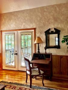 a living room with a piano and a mirror at C13 - Forest View two bedroom, two bath Harbor North luxury loft cottage with private hot tub o Lake on Ouachita in Mount Ida +39 photos