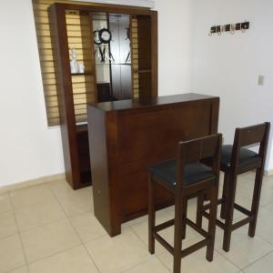 a kitchen with a wooden table and two chairs at Casa Libertad in Guanajuato