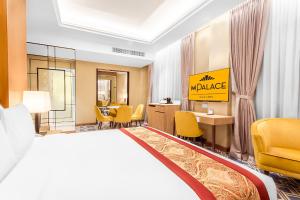 Postel nebo postele na pokoji v ubytování MPalace Hotel KL