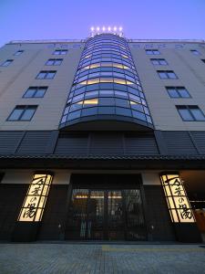 a tall building with lights on top of it at Tokyo Yugawara Onsen Manyo no Yu in Machida