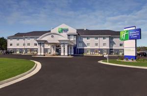 a large building with a sign in front of it at Holiday Inn Express & Suites North Fremont by IHG in Fremont