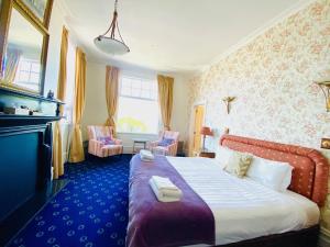 Voodi või voodid majutusasutuse The Esplanade Hotel toas