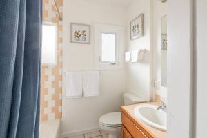 a bathroom with a toilet and a sink at Beautiful home, Central location, Close to Beach in Seattle