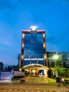 a tall building with lights on top of it at Hotel Mỹ Mỹ in Tây Ninh