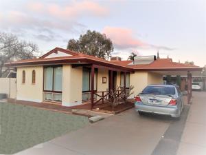 a house with a car parked in front of it at 2BR house in West Lamington in Kalgoorlie