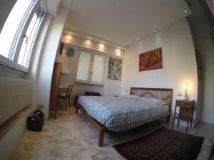 Postel nebo postele na pokoji v ubytování B&B Rosa Blu