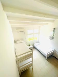 Katil atau katil-katil dalam bilik di Uchuva beach house