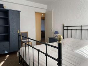 a bedroom with a bed and a dresser with a lamp at Appartement T3 Mezzanine 6 Couchages à 300m de la plage, Parking Privé - FR-1-225C-118 in Banyuls-sur-Mer