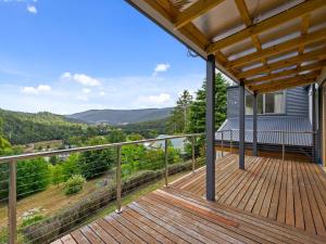 a deck with a view of the mountains at The Springs in Marysville
