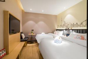 Postel nebo postele na pokoji v ubytování Meego Smart Select Hotel