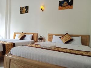 Postel nebo postele na pokoji v ubytování Khách sạn Trọng Tín