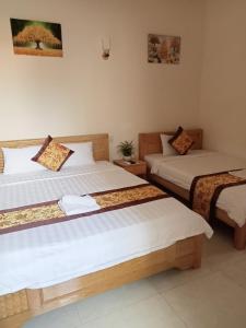 Postel nebo postele na pokoji v ubytování Khách sạn Trọng Tín