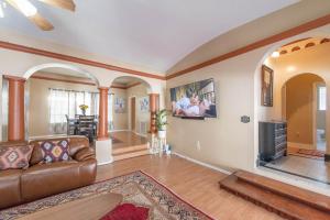 a living room with a couch and a fireplace at A Spanish Castle For Your Living Pleasure in Little Rock