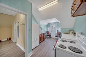 a kitchen with a white stove top oven in a room at Marmora and Lake Inn and Victorian Diner in Marmora