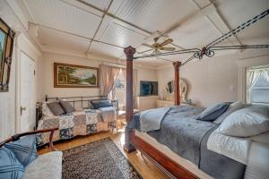 a bedroom with two beds and a ceiling at Marmora and Lake Inn and Victorian Diner in Marmora