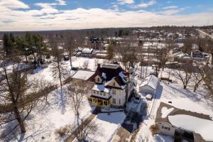 an aerial view of a house in the snow at Marmora and Lake Inn and Victorian Diner in Marmora