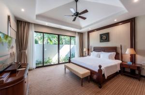Ein Bett oder Betten in einem Zimmer der Unterkunft Vinpearl Resort & Spa Phu Quoc