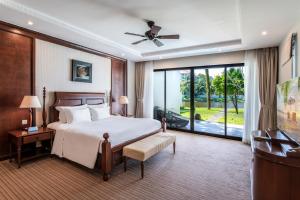 Ein Bett oder Betten in einem Zimmer der Unterkunft Vinpearl Resort & Spa Phu Quoc